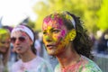 Face of young woman with colored powder Royalty Free Stock Photo